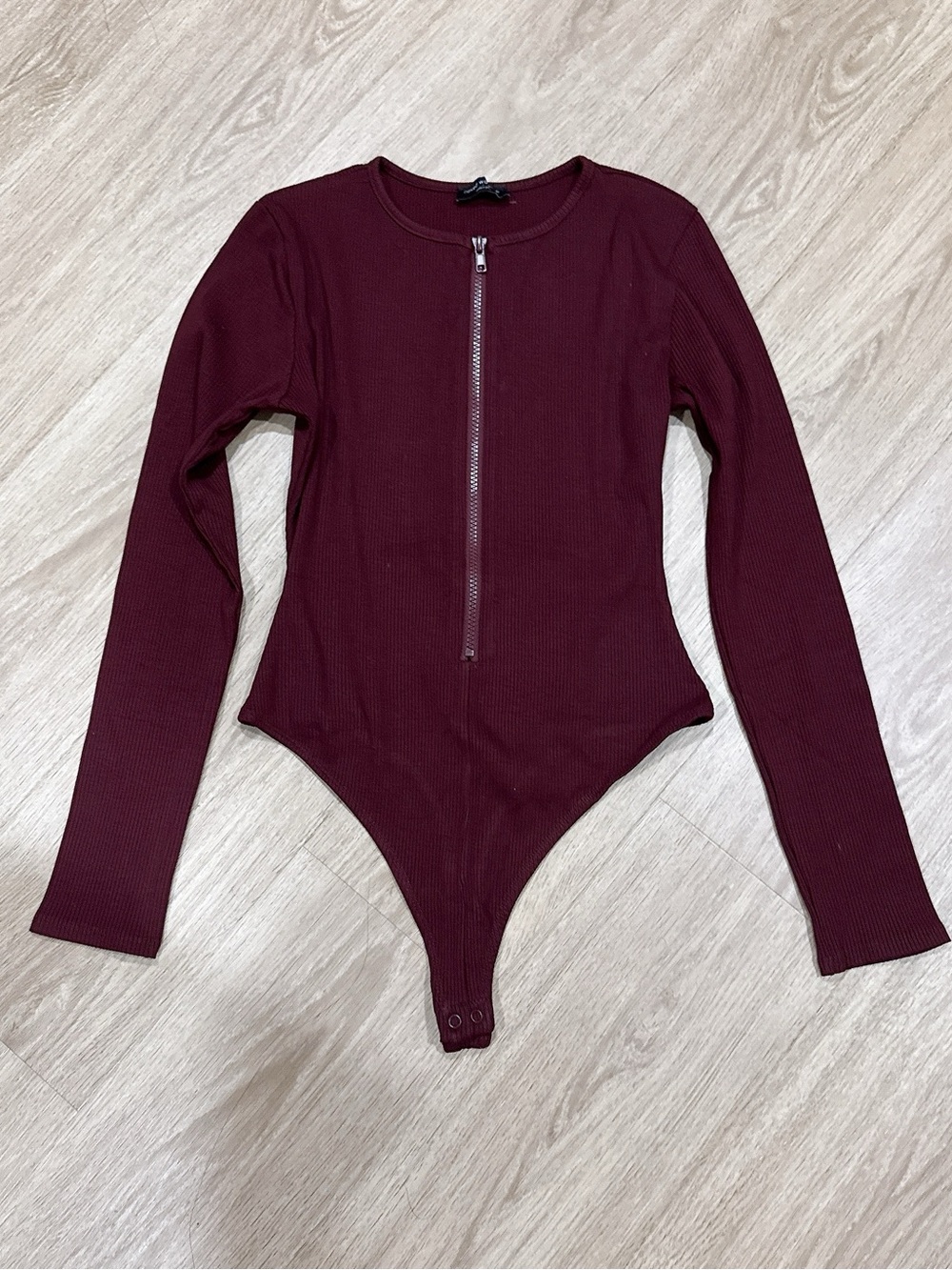 naked wardrobe Burgundy Ribbed Long-Sleeve Zip Front Bodysuit